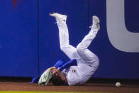 New York Mets' Albert Almora Jr. loses control of the ball hit by Baltimore Orioles' Austin Hays for a triple during the eighth inning of a baseball game Tuesday, May 11, 2021, in New York. (AP Photo/Frank Franklin II)