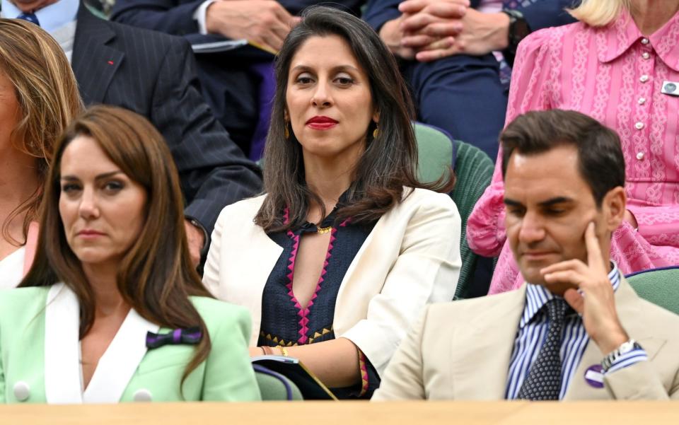 Nazanin Zaghari-Ratcliffe watches Andy Murray&#39;s victory, sitting behind the Princess of Wales and Roger Federer