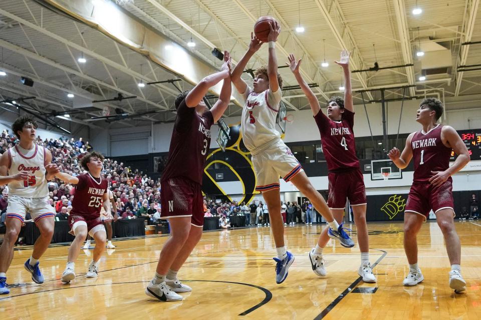 Olentangy Orange's Devin Brown shoots over Newark's Steele Meister on Wednesday.