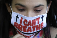 A demonstrator attend the Chicago March for Justice in honor of George Floyd at Chicago's Union Park Saturday, June 6, 2020, in Chicago. Demonstrators who gathered at Union Park marched through the city's West Side on Saturday afternoon, as the city prepared for another weekend of rallies. (AP Photo/Nam Y. Huh)