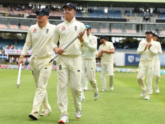 Dom Bess and Ollie Pope lead England off the field after victory in the third Test (Getty)