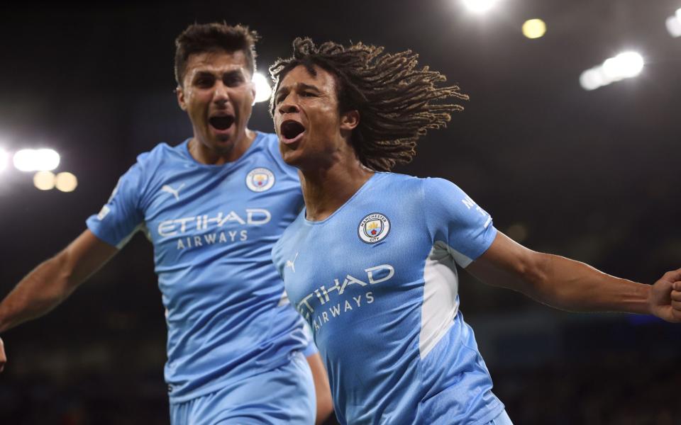 Nathan Ake of Man City celebrates the opening goal with Rodrigo during the UEFA Champions League group A match between Manchester City and RB Leipzig - Charlotte Wilson/Offside via Getty Images