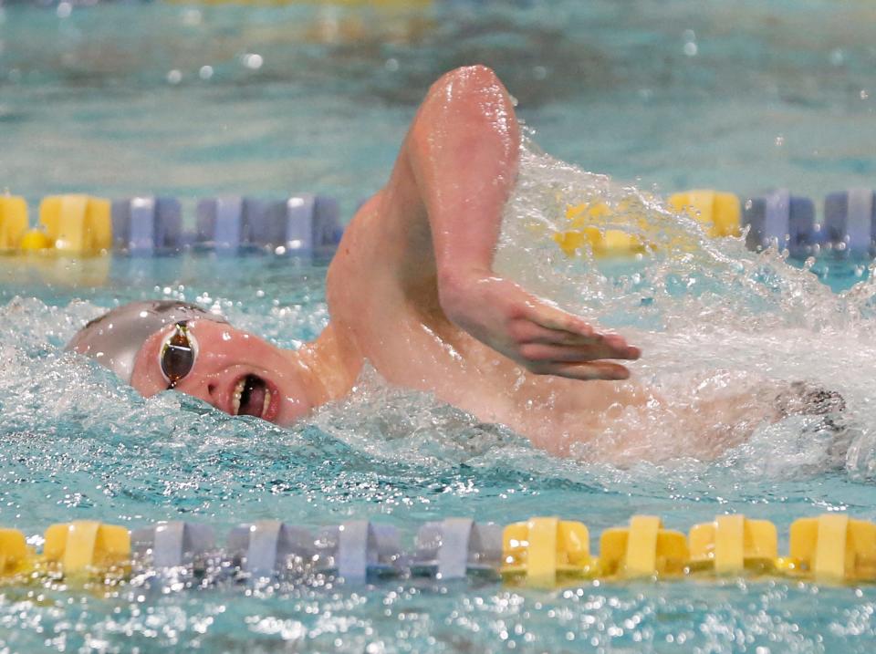 South Bend Trinity at Greenlawn's Will Scarlett competes in the 500-yard freestyle race during the boys swimming city meet Saturday, Jan. 20, 2024, at Riley High School. Scarlett won the race, making him the first winner from Trinity in city meet history.