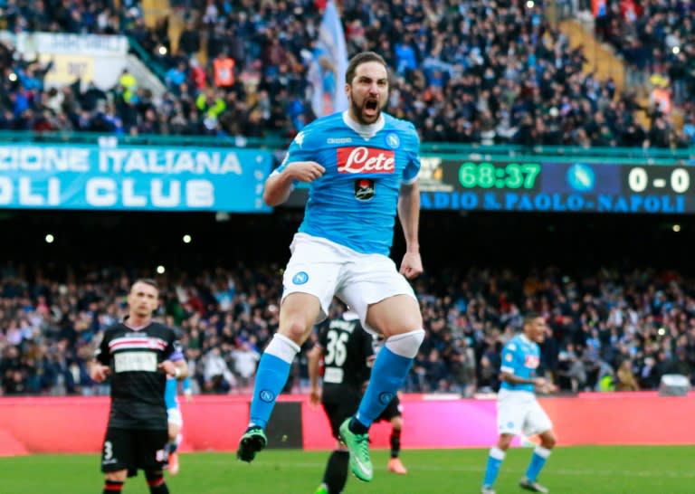 Napoli's forward Gonzalo Higuain celebrates after scoring during the Italian Serie A match against Carpi on February 7, 2016