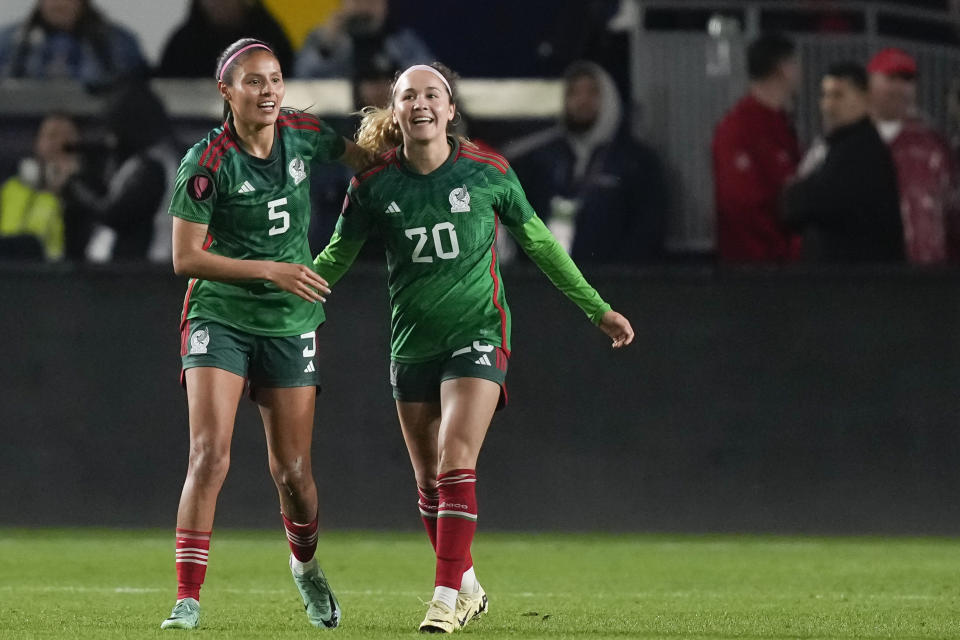 Mexico midfielder Mayra Pelayo-Bernal, right, celebrates her goal with defender Karen Luna during a CONCACAF Gold Cup women's soccer tournament match against the United States, Monday, Feb. 26, 2024, in Carson, Calif. (AP Photo/Ryan Sun)