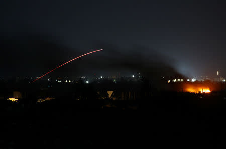 Fire is seen during fighting in the Islamic State's final enclave, in the village of Baghouz, Deir Al Zor province, Syria March 17, 2019. REUTERS/Stringer