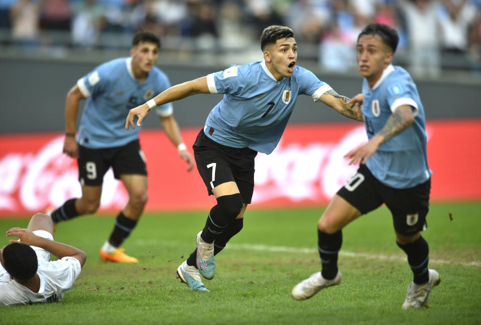 Uruguay's Anderson Duarte, center, celebrates scoring his side's opening goal against Israel during a FIFA U-20 World Cup semifinal soccer match at the Diego Maradona stadium in La Plata, Argentina, Thursday, June 8, 2023. (AP Photo/Gustavo Garello)