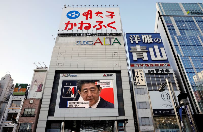 FILE PHOTO: News conference of Japanese Prime Minister Shinzo Abe is broadcasted in Tokyo