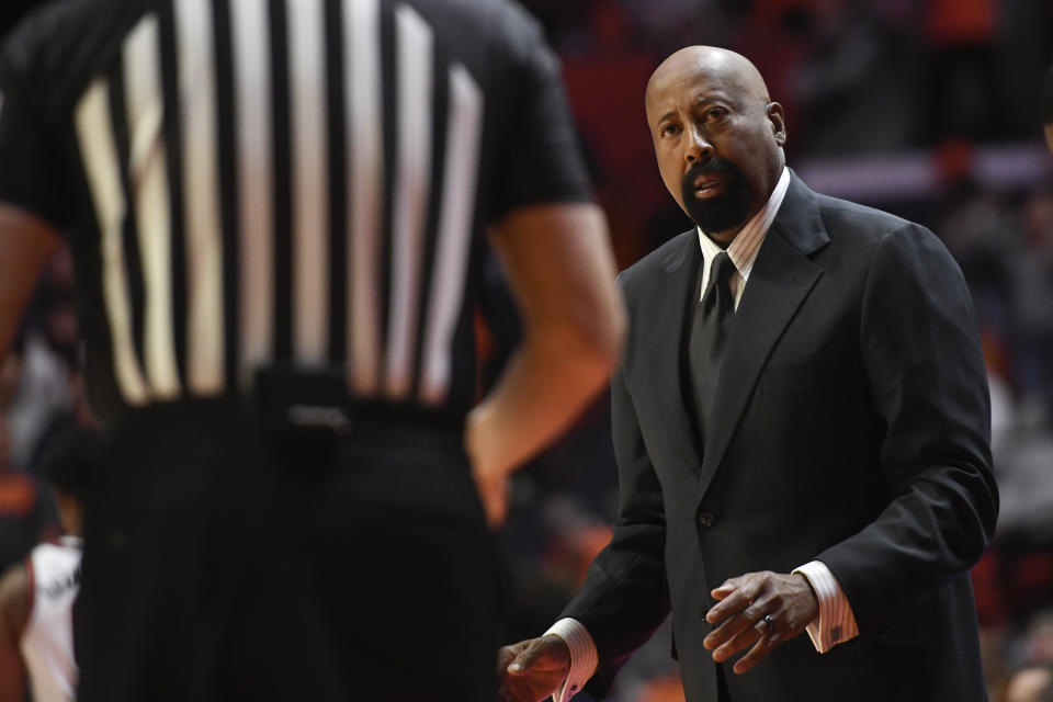 Indiana coach Mike Woodson talks with an official during the first half of an NCAA college basketball game against Illinois, Thursday, Jan. 19, 2023, in Champaign, Ill. (AP Photo/Michael Allio)