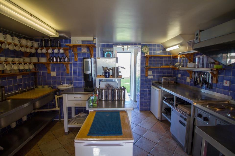 The kitchen with blue tiles