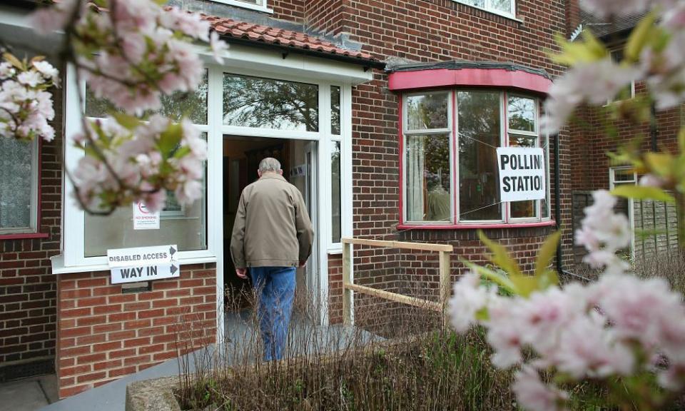 Members of the public arrive to cast their votes at a residential home that has been turned into a polling station on May 6, 2010 in Dudley, England.