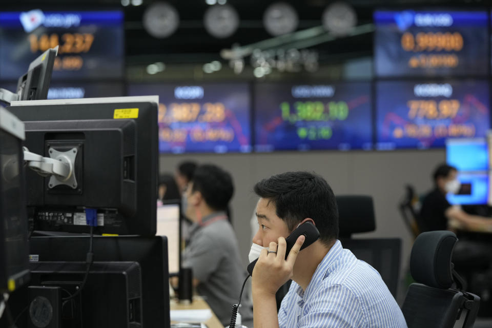 A currency trader watches monitors at the foreign exchange dealing room of the KEB Hana Bank headquarters in Seoul, South Korea, Thursday, Sept. 8, 2022. Asian benchmarks mostly rose Thursday, as investor optimism got a perk from a rally on Wall Street that's on track to break a three-week losing streak. (AP Photo/Ahn Young-joon)