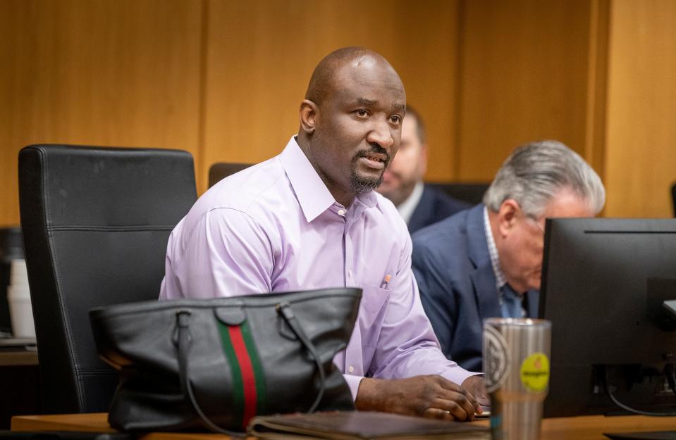 Marcelle Waldon sits at the defense table without a mask before the jury is brought in during the second day of testimony in his first-degree murder trial Tuesday.