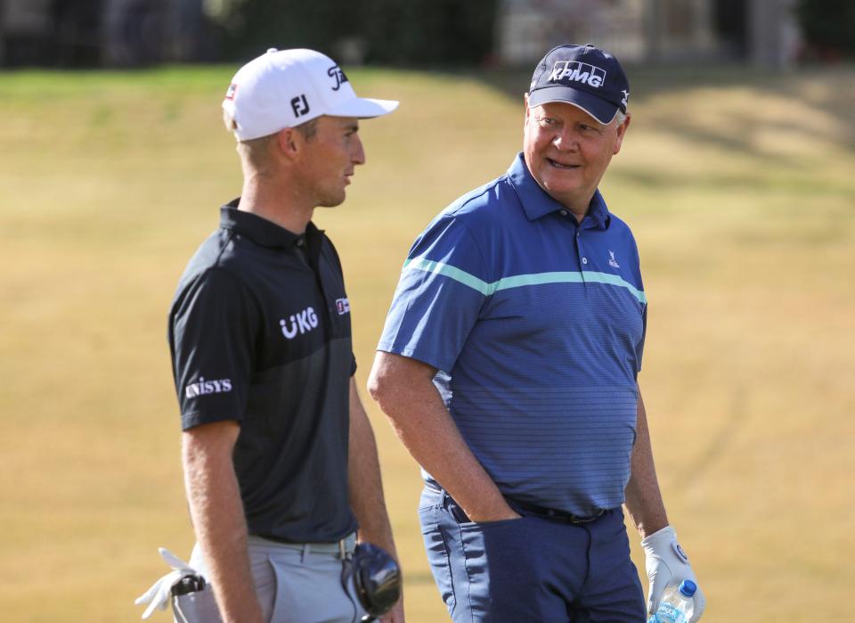 Amateur golfer Scott Flynn talks with professional Will Zalatoris while playing the 11th hole of the Pete Dye Stadium course during the third round of The American Express at PGA West in La Quinta, Calif., Saturday, Jan. 22, 2022. 