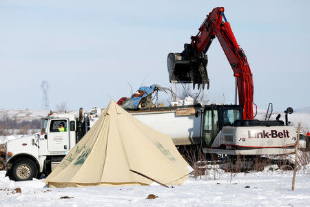 Crews remove waste from the opposition camp against the Dakota Access oil pipeline near Cannon Ball, North Dakota, U.S., February 8, 2017. REUTERS/Terray Sylvester