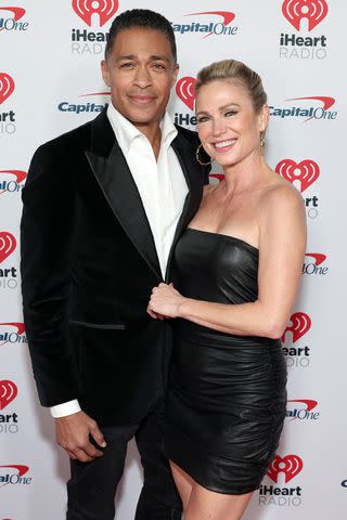 <p>Leon Bennett/WireImage</p> T.J. Holmes and Amy Robach attend iHeartRadio's Jingle Ball 2023