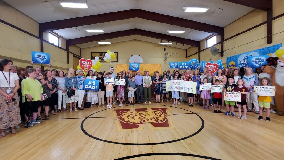 People gather before Ken Abbott's surprise "Good Morning America" segment at Nash Elementary in Weymouth on Friday, June 16, 2023.