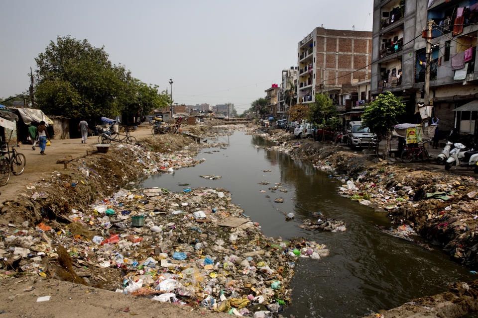 Pictured are plastic and garbage floating on an open drain in New Delhi, India, on September 20, 2016.