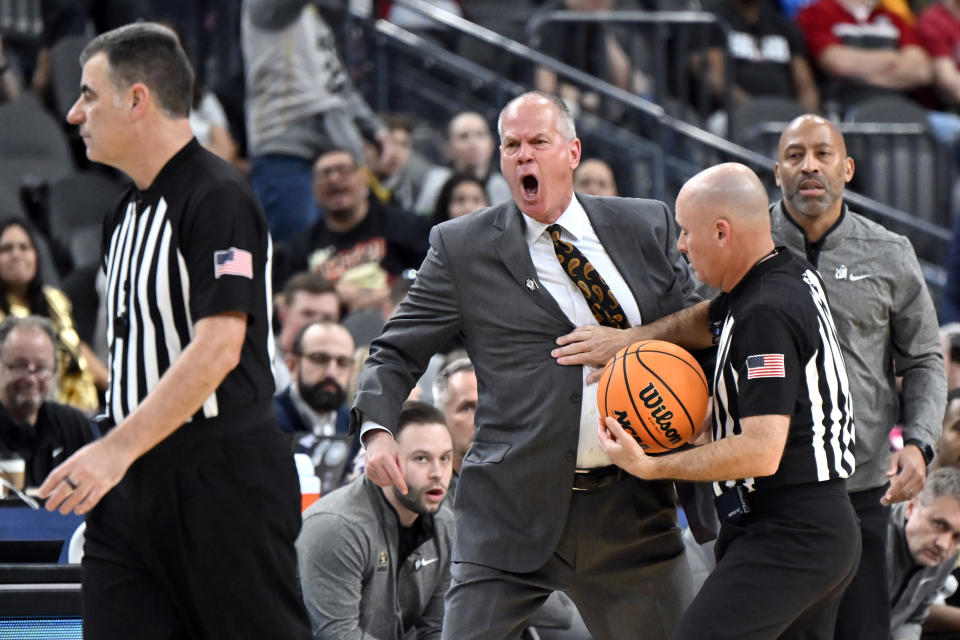 Colorado head coach Tad Boyle is held back as he reacts after being ejected from the game during the second half of an NCAA college basketball game against UCLA in the quarterfinals of the Pac-12 Tournament, Thursday, March 9, 2023, in Las Vegas. (AP Photo/David Becker)