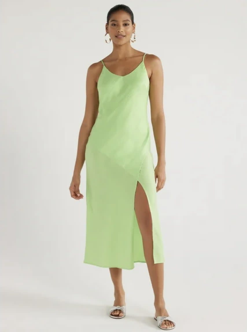 A light green satin slip dress