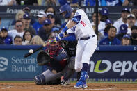 Los Angeles Dodgers' AJ Pollock hits a solo home run in the second inning against the Atlanta Braves in Game 5 of baseball's National League Championship Series Thursday, Oct. 21, 2021, in Los Angeles. (AP Photo/Marcio Jose Sanchez)