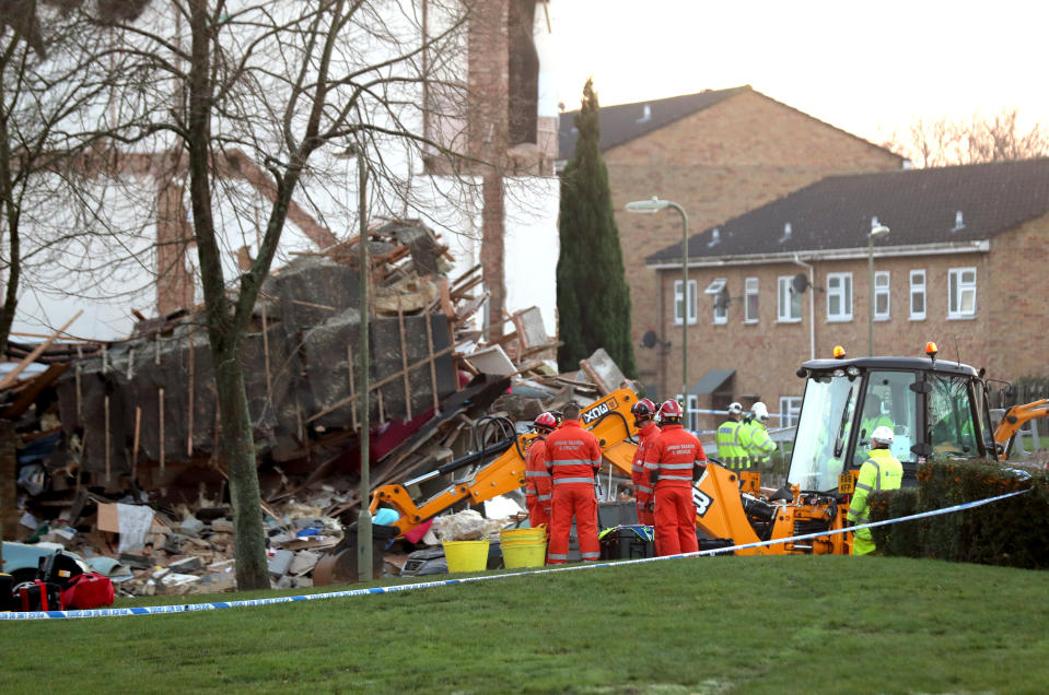 Gas engineers and an urban search and rescue team at the scene in Launcelot Close, Andover, where James Kirkby’s body was found on Thursday. (PA).