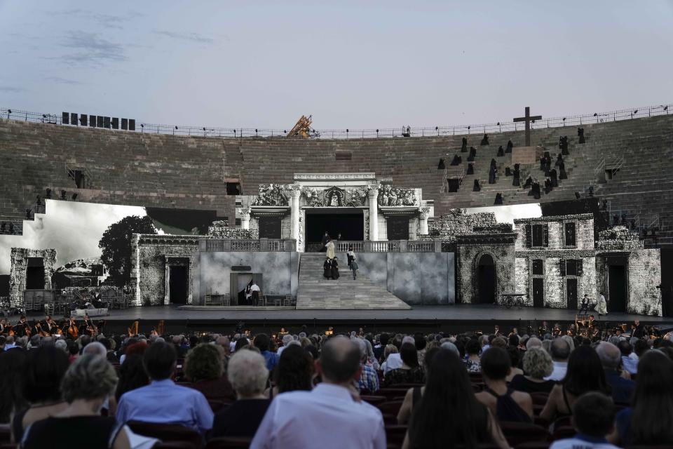 A view of the stage during 'Cavalleria Rusticana' lyric opera, at the Arena di Verona theatre, in Verona, Italy, Friday, June 25, 2021. The Verona Arena amphitheater returns to staging full operas for the first time since the pandemic struck but with one big difference. Gone are the monumental sets that project the scene to even nosebleed seats in the Roman-era amphitheater, replaced by huge LED screens with dynamic, 3D sets that are bringing new technological experiences to the opera world. (AP Photo/Luca Bruno)