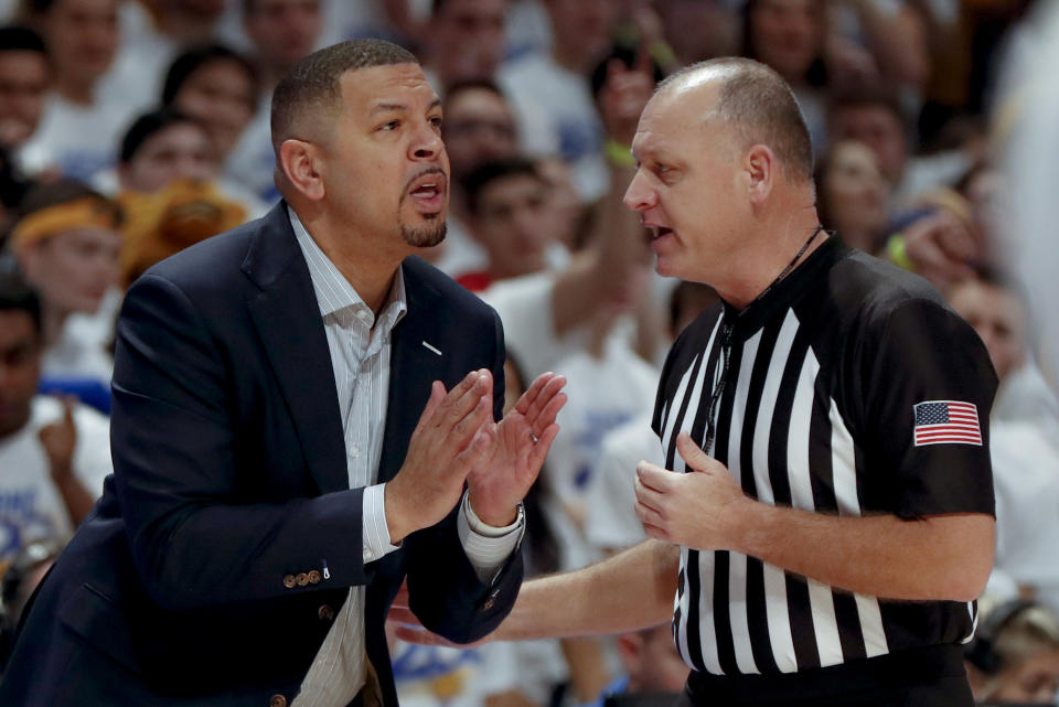 Pittsburgh head coach Jeff Capel, left, talks with an official about a foul call as his team plays against North Carolina during the first half of an NCAA college basketball game, Saturday, Jan. 18, 2020, in Pittsburgh. Pittsburgh won 66-52.(AP Photo/Keith Srakocic)