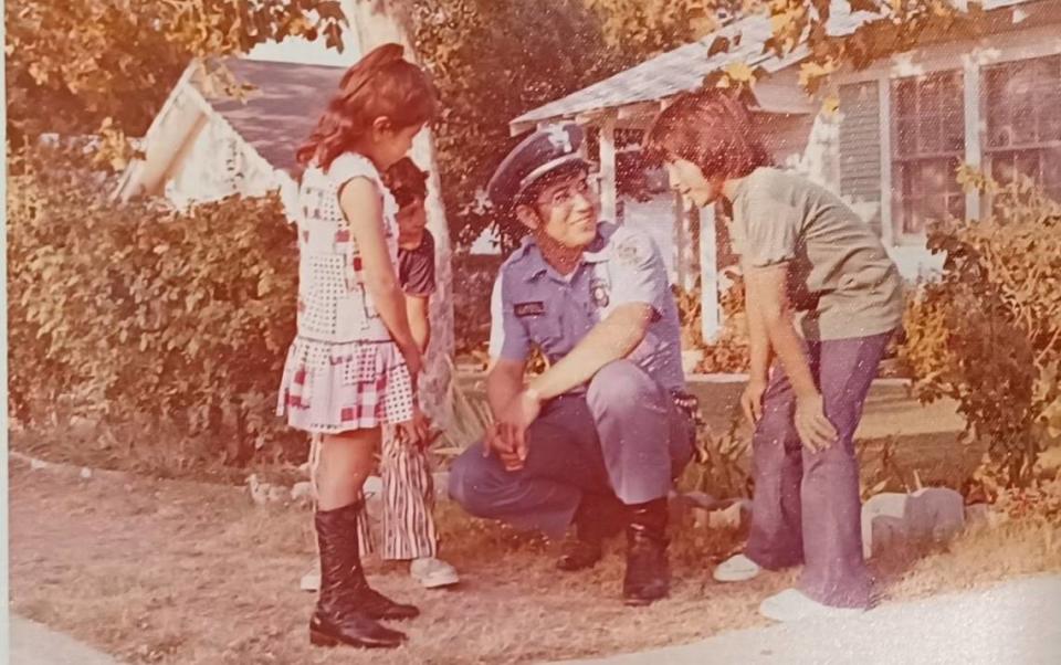 Fort Worth police officer Rufino Mendoza Jr. worked in the Community Service Division. He is speaking here with Worth Heights youth in 1973. Courtesy, Rufino Mendoza Jr.