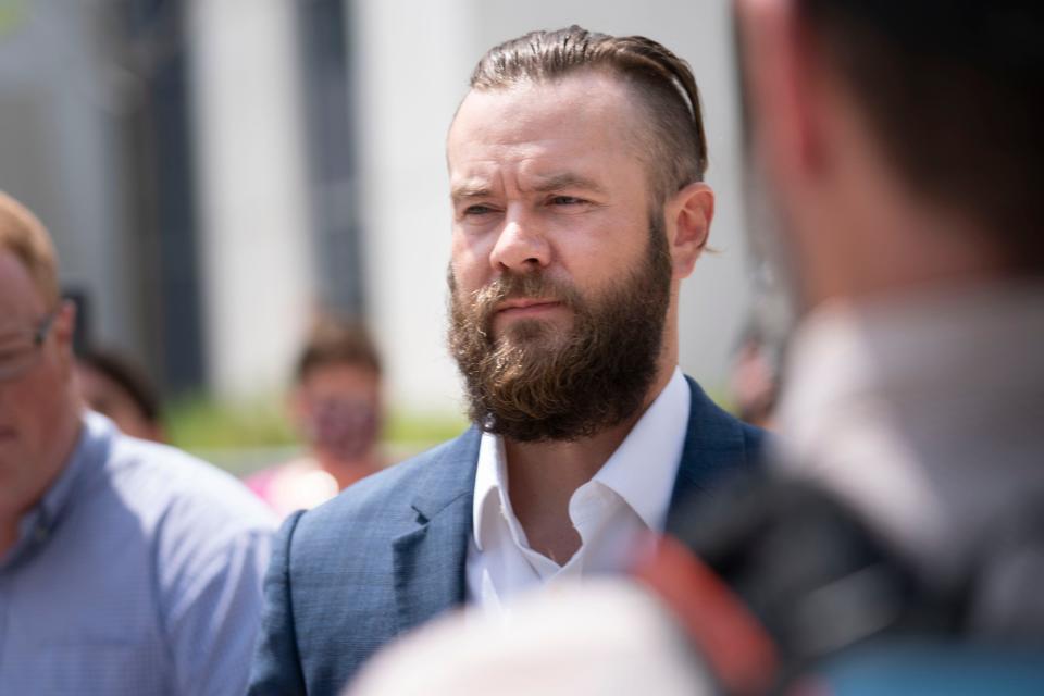 Cade Cothren, former aide to former Tennessee House Speaker Glen Casada, walks out of the Fred D Thompson Federal Building & Courthouse after pleading not guilty to federal charges ranging from money laundering to bribery Tuesday, Aug. 23, 2022 in Nashville, Tenn .  