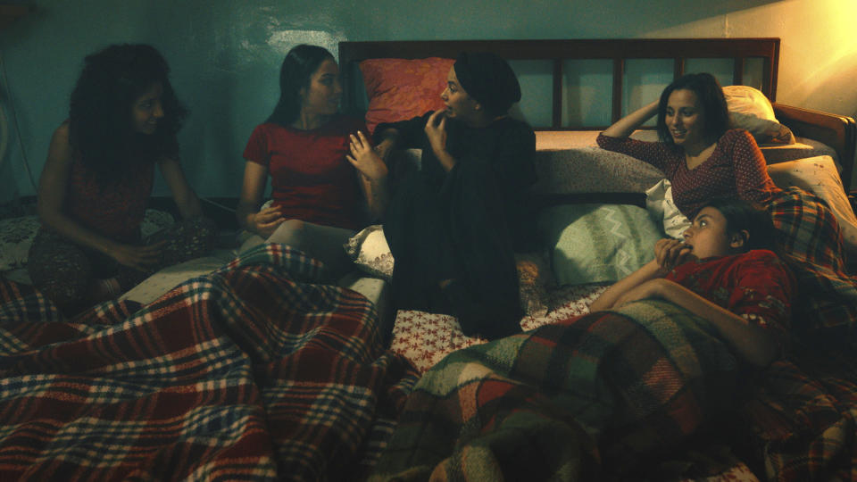 This image provided by Kino Lorber shows Ichraq Matar, Eya Chikhaoui, Hend Sabri, Nour Karoui, Tayssir Chikhaoui in the movie Four Daughters, filmed in Tunis, Tunisia. The film about a Tunisian family and the radicalization of two teenage daughters who joined the Islamic State is up for one of the most prestigious film awards in the world. (Kino Lorber via AP)