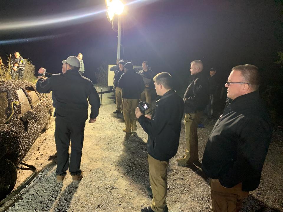 Police officers and other emergency workers were on the scene Wednesday night, Nov. 10, 2021, after the car belonging to Miriam Ruth Clark Hemphill, who has been missing since July 22, 2005, was pulled from Melton Hill Lake.
