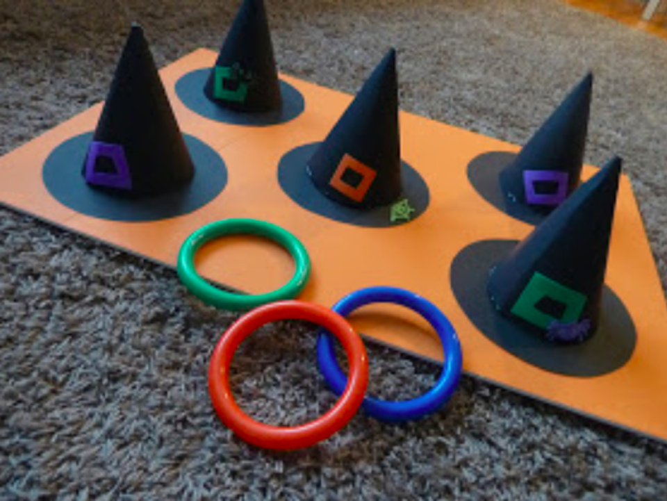 <p>Sometimes Creative</p><p>This ring toss game by <a href="https://sometimescreative.blogspot.com/2011/11/halloween-party.html?m=1" rel="nofollow noopener" target="_blank" data-ylk="slk:Sometimes Creative;elm:context_link;itc:0;sec:content-canvas" class="link ">Sometimes Creative</a> is so easy to put together. All you need is a colorful foam board for a base, poster board, glue and rings!</p>