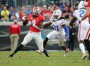 Oct 27, 2018; Jacksonville, FL, USA; Georgia Bulldogs wide receiver Jeremiah Holloman (9) catches the ball against Florida Gators defensive back Shawn Davis (31) during the second half at TIAA Bank Field. Mandatory Credit: Kim Klement-USA TODAY Sports