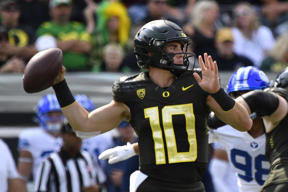 Oregon quarterback Bo Nix (10) looks to throw against BYU during the first half of an NCAA college football game Saturday, Sept. 17, 2022, in Eugene, Ore. (AP Photo/Andy Nelson)