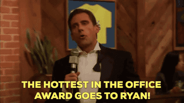 Michael says, "The hottest in the office award goes to Ryan!" As Ryan looks uncomfortable