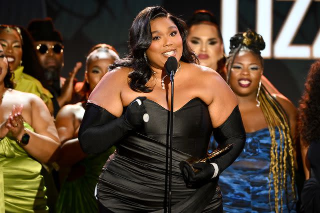 <p>Michael Buckner/Variety via Getty Images</p> Lizzo speaks onstage at the 2023 Black Music Action Coalition Gala at The Beverly Hilton on September 21, 2023 in Beverly Hills, California.