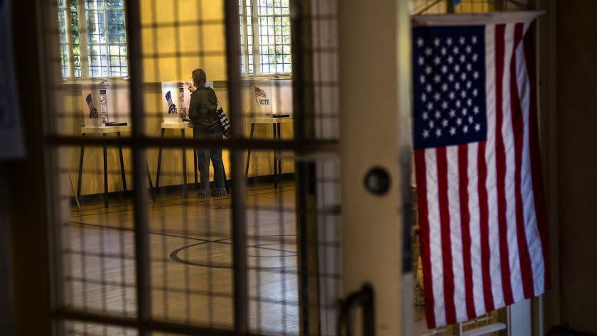 LOS ANGELES, CA - JUNE 4, 2019: A voter checks her ballot while voting at Silver Lake Recreation Center on June 4, 2019 in Los Angeles, California. Voters are deciding on the schools tax by LAUSD Measure EE and LA City Council election for District 12.(Gina Ferazzi/Los AngelesTimes)