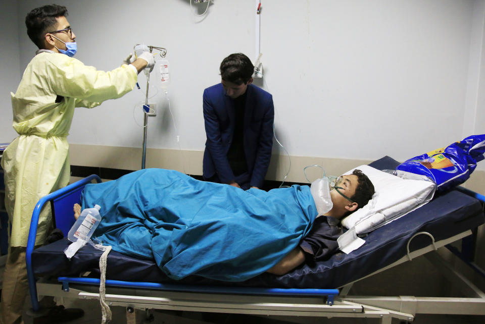 An Afghan receives treatment at hospital after suicide attack in Kabul, Afghanistan, Saturday, Oct. 24, 2020. The death toll from the suicide attack Saturday in Afghanistan's capital has risen that includes schoolchildren, the interior ministry said.. (AP Photo/Mariam Zuhaib)
