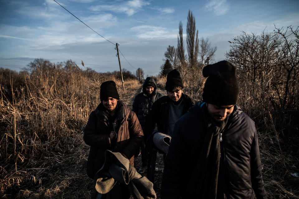 <p>Migrants from Pakistan walk their way towards Hungary following the railroad which takes from the Serbian town Subotica to the border, Feb. 2017. (Manu Brabo/MeMo) </p>