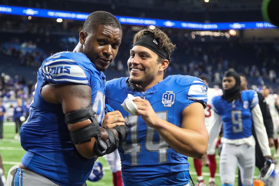 Detroit Lions linebacker Julian Okwara (99) shakes hands with linebacker Malcolm Rodriguez (44) after 21-16 win over the New York Giants at a preseason game at Ford Field in Detroit on Friday, Aug. 11, 2023.