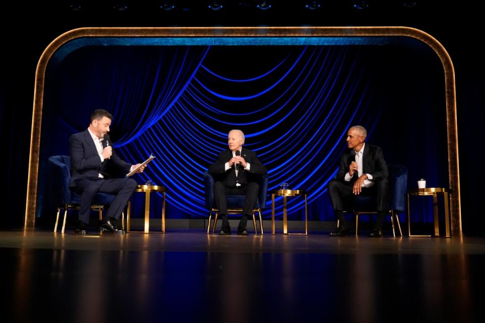 Jimmy Kimmel moderates a panel of President Joe Biden and former president Barack Obama at a fundraising event on Saturday in Los Angeles (AP)