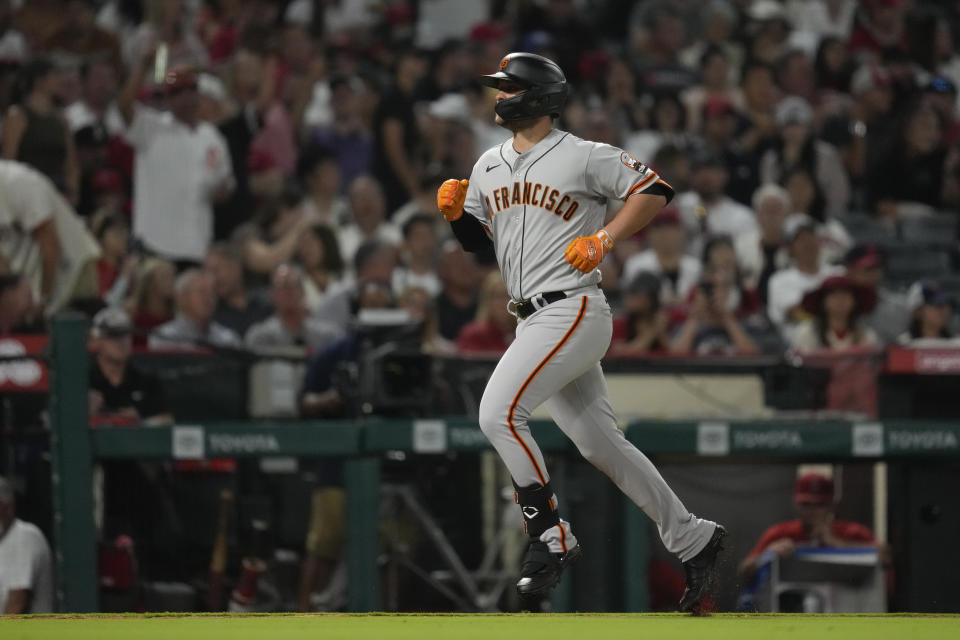 San Francisco Giants' J.D. Davis runs the bases after hitting a home run during the seventh inning of a baseball game against the Los Angeles Angels in Anaheim, Calif., Monday, Aug. 7, 2023. (AP Photo/Ashley Landis)