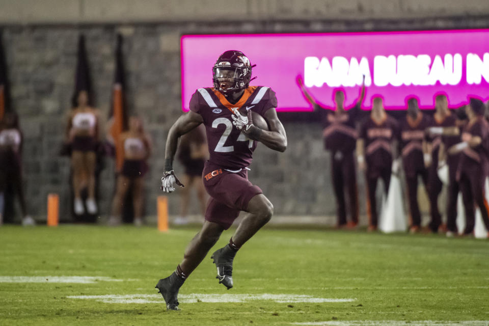 Virginia Tech's Malachi Thomas runs the ball against Syracuse during the second half of an NCAA college football game Thursday, Oct. 26, 2023, in Blacksburg, Va. (AP Photo/Robert Simmons)