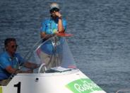 2016 Rio Olympics - Rowing - Repechage - Men's Single Sculls Repechages - Lagoa Stadium - Rio De Janeiro, Brazil - 07/08/2016. Race officials stand by in a boat shortly after competition was postponed due to high winds. REUTERS/Carlos Barria