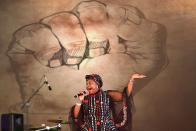 <p>South African singer Yvonne Chakachaka performs at the opening of the Sauti Kuu Resource Centre by former US President, Barak Obama, that is an initiative of his half-sister, Auma Obama’s Foundation on July 16, 2018 at Kogelo in Siaya county, western Kenya. – Obama is in the east african nation for the first time since he left the US presidency and met with President Uhuru Kenyatta and opposition leader Raila Odinga in Nairobi. (Photo: Tony Karumba/AFP/Getty Images) </p>