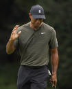 Tiger Woods waves after a birdie on the 15th hole during the first round of the Masters golf tournament Thursday, Nov. 12, 2020, in Augusta, Ga. (AP Photo/Chris Carlson)