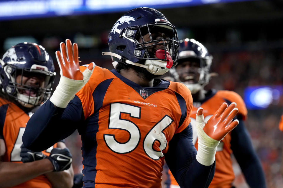 Denver Broncos linebacker Baron Browning (56) celebrates his touchdown against the Minnesota Vikings during the first half of an NFL preseason football game, Saturday, Aug. 27, 2022, in Denver. (AP Photo/David Zalubowski)