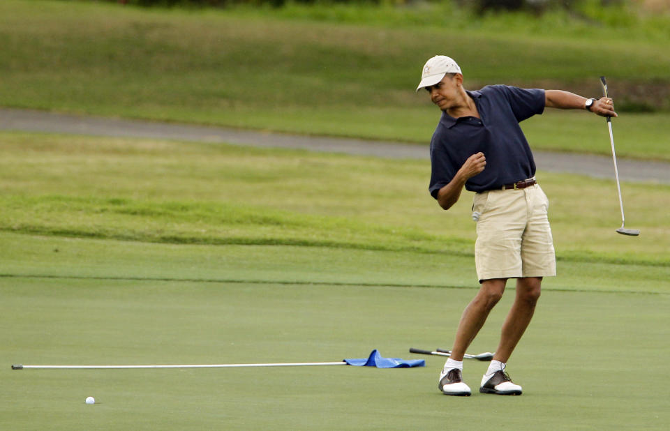 On New Year's Eve in 2009, Obama made the classic golf player gesture as he watched a golf ball after putting at Mid-Pacific County Club in Kailua, Hawaii.  (AP Photo/Chris Carlson, File)