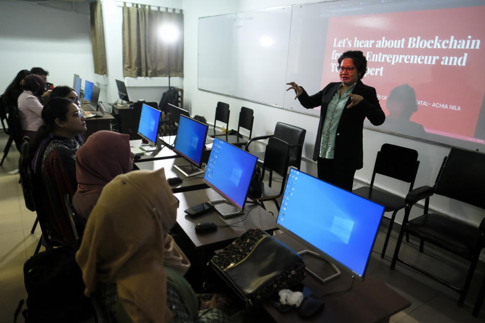 Achia Nila, founder of 'Women in Digital' technology center addresses a workshop at a university in Dhaka, Bangladesh, Dec. 26, 2023. Nila said many youngsters feel frustrated with corruption and bureaucracy and prefer to migrate to other countries because of “better opportunities”. Ahead of the Jan. 7 vote being boycotted by the main opposition, Prime Minister Sheikh Hasina is trying to woo the country’s first-time voters by carrying forward her government’s “Digital Bangladesh” project and promising a “smart Bangladesh” by 2041. (AP Photo/Mahmud Hossain Opu)